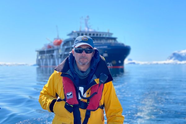Antarctica expedition guide driving an inflatable dingy