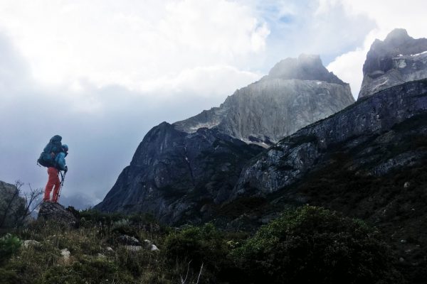 Female hiker amidst the mountains in Torres del Paine, Chile